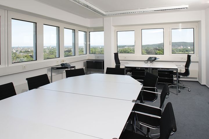 empty office with white table and black chair