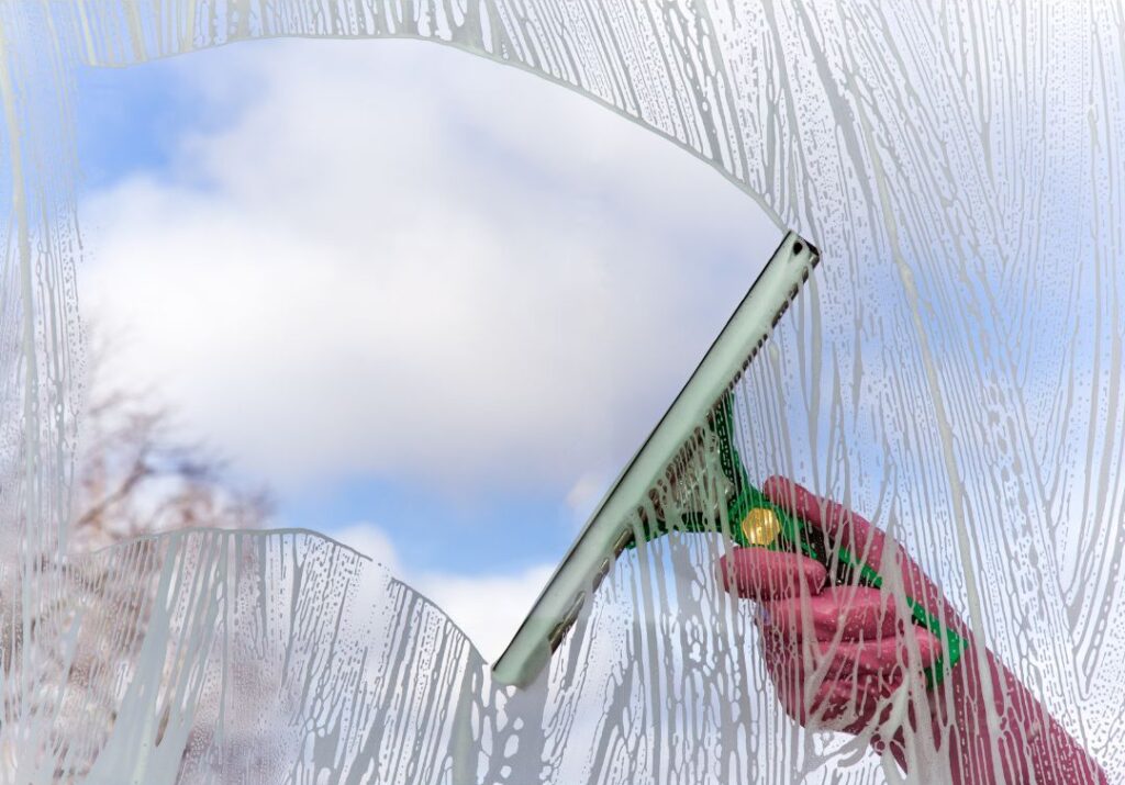 Person cleaning the window