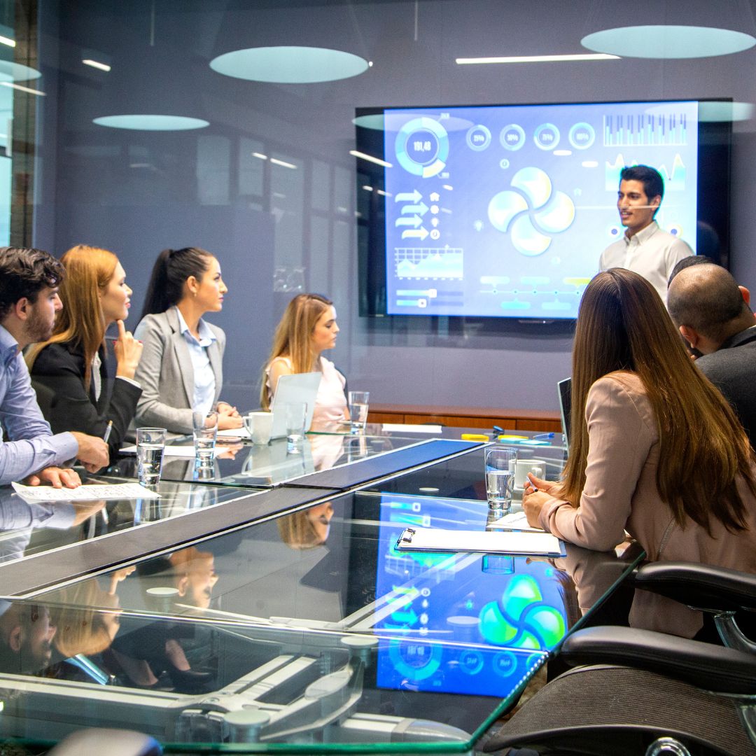 group meeting with male presenter in front