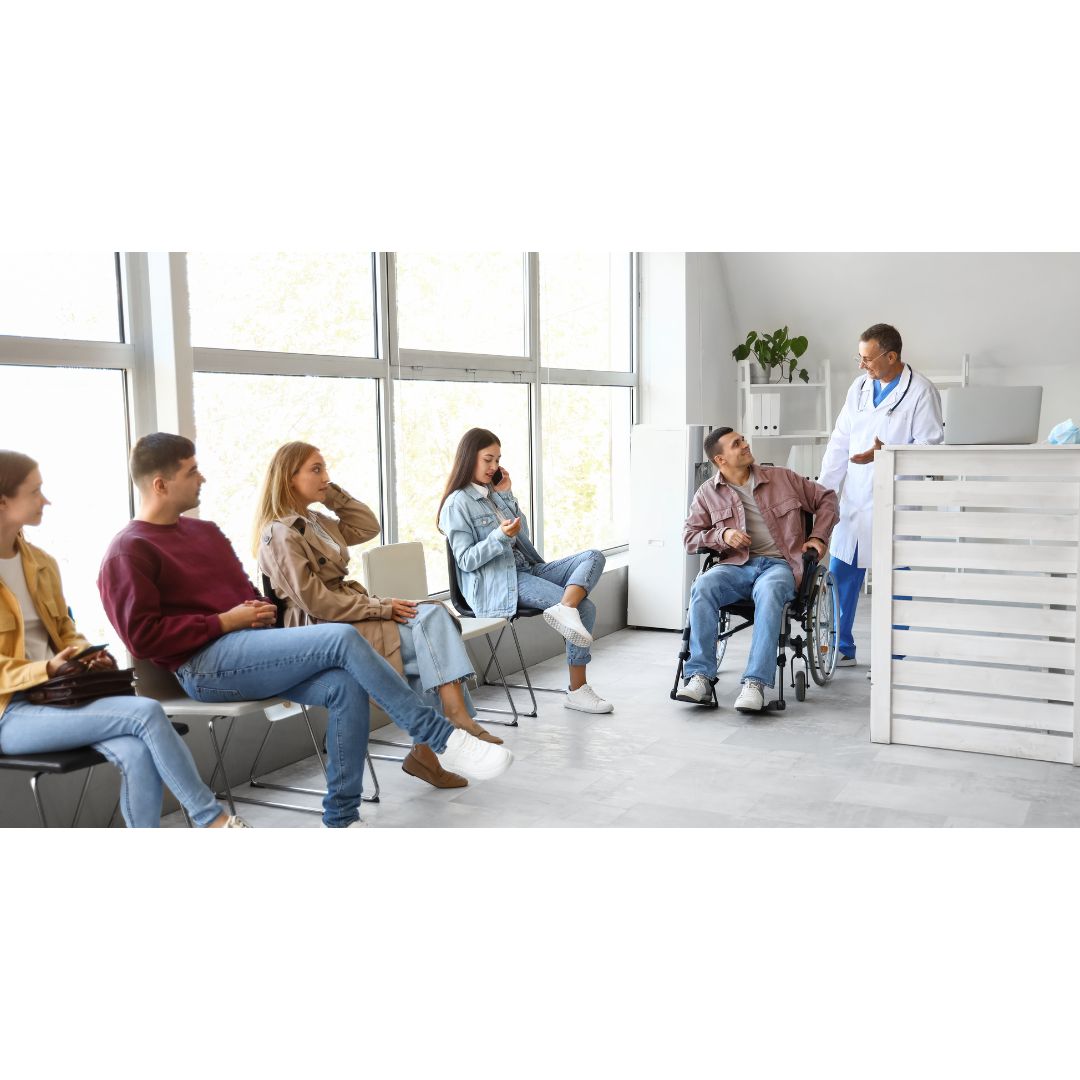 Doctor talking with the patient on wheelchair