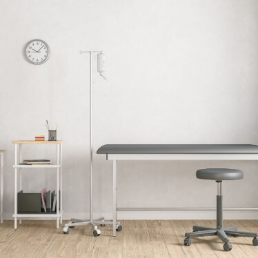 Image of a clinic with some small table and documents